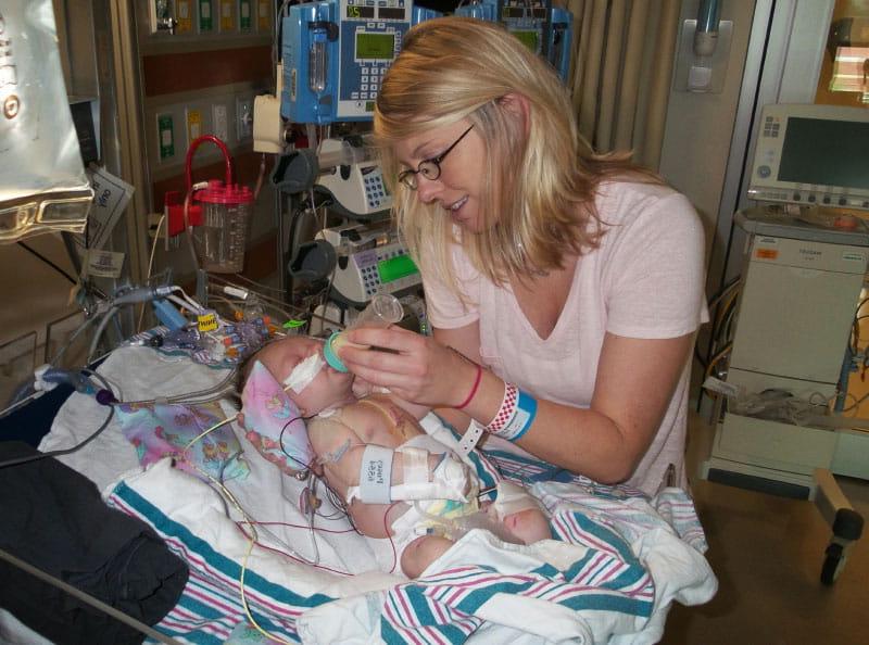 Jamie feeds Jackson as he recovers from one of the two open-heart surgeries he endured within his first three months. (Photo courtesy of the Dawson family)